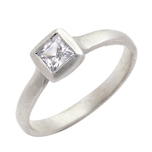  Solitaire princess cut diamond ring set in white gold.